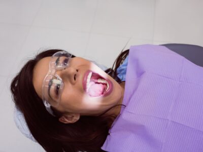 female-patient-receiving-dental-treatment_107420-65506